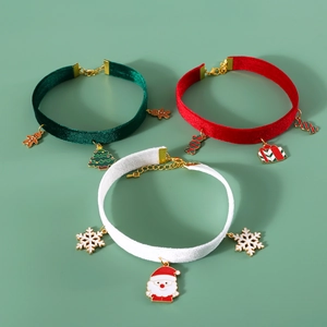 Three velvet pet collars with Christmas pendants like Santa, trees and gift boxes