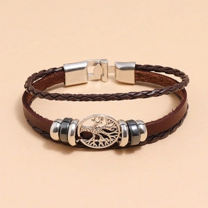 Detail of multi-layer braided leather bracelet with silver tree of life charm and beads