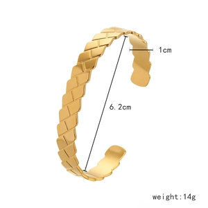 Close-up of golden braided cuff bracelet showing 1cm width and 6.2cm inner diameter size