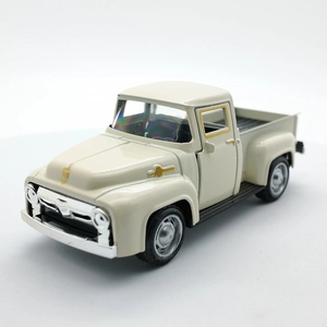 Macro shot of vintage beige alloy pickup truck model with silver grille details