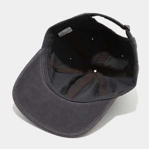 Detailed interior of vintage cotton hip hop cap showing stitching and 100% cotton label