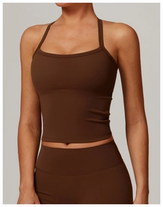 Detail of chocolate brown athletic bra top and high-waist yoga pants in matte fabric