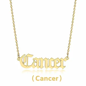 Detail view of a gold Cancer zodiac necklace featuring Old English font and cable chain