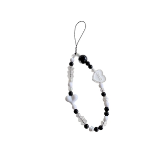 Minimalist phone charm featuring black and white beads with an engraved Love heart pendant