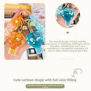 Macro detail of hot air balloon keychain with colorful liquid glitter and star sequins