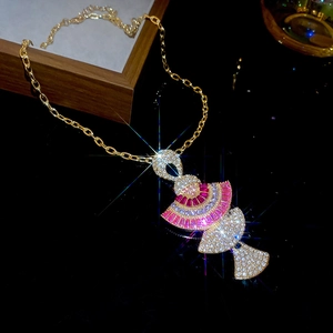 Detailed view of fan-shaped pendant necklace with sparkling pink and clear crystals