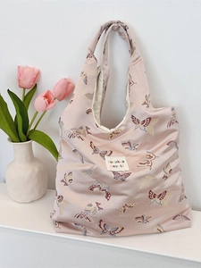 Pink jacquard shoulder bag with butterfly patterns and minimalist brand label detail