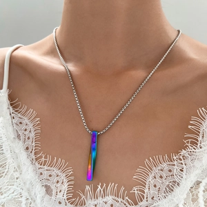 Minimalist spiral necklace with iridescent rainbow twist pendant and silver chain
