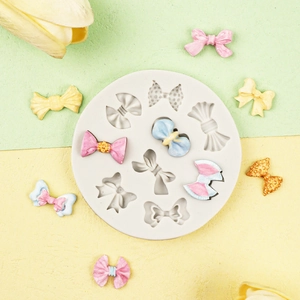 Detailed top view of silicone fondant bow mold with various sizes and elegant shapes