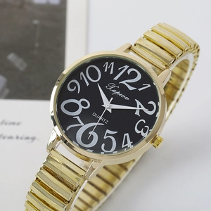 Close-up of golden watch with easy-to-read large black dial and elastic metal band
