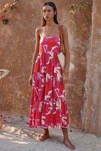 Detailed view of pink and red floral print on layered summer maxi dress with thin straps