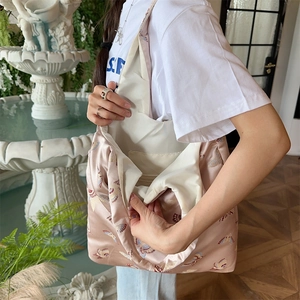 Detail of light pink satin tote bag with vintage butterfly embroidery and spacious interior