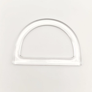 Close-up of a clear resin D-shaped handle for DIY handbags with polished transparent finish