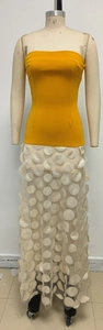 Detailed view of yellow strapless gown featuring 3D polka dot applique on mesh tulle fabric