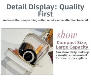 Detail view of the white simple fashion cosmetic bag, showing spacious interior storage capacity.
