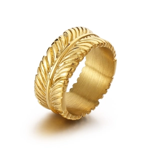 Minimalist golden feather stainless steel ring with detailed texture on white background