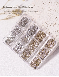 Close-up of 12-grid nail art rhinestones with flatback crystals in clear and silver
