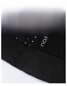 Macro view of breathable mesh fabric and moisture-wicking sweatband on black sports cap