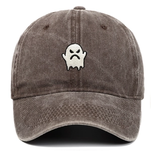 Detailed embroidery of a white angry ghost on a brown washed denim baseball cap