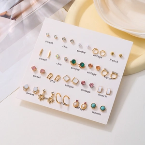 20-pair gold earring set featuring rhinestones, pearls, and geometric shapes on a tray