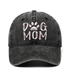 Washed black baseball cap with embroidered Dog Mom text and paw print design