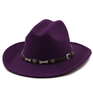 Detail of dark purple wool cowboy hat with leather band and metal star studs