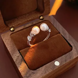 Elegant silver twisted open ring with double white pearls and micro-pave zircons