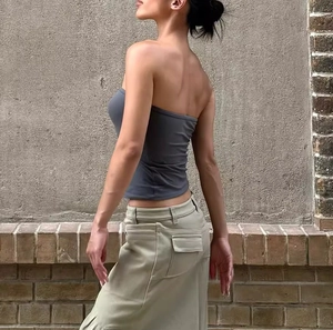 Slim-fit grey tube top and khaki cargo skirt shown from a side-back view on model