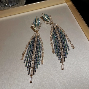 Elegant U-shaped silver needle earrings with blue gradient crystals and long tassels