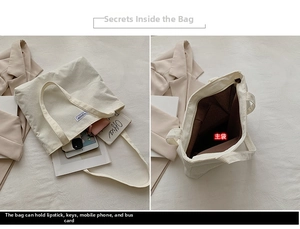 Detail of cream corduroy tote bag showing spacious main pocket and fashion label