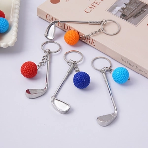 Mini metal golf club and ball keychains set in four vibrant colors for bag charms