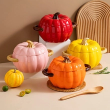 Detailed close-up of pumpkin-shaped ceramic stew pots in red, pink, yellow, and orange