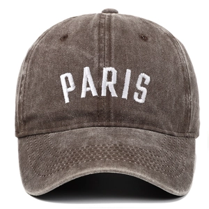 Macro shot of PARIS letter embroidery on washed cotton vintage baseball cap