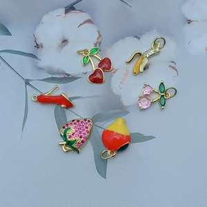 Golden fruit charms set with enamel cherries, strawberry, and sparkling zircons