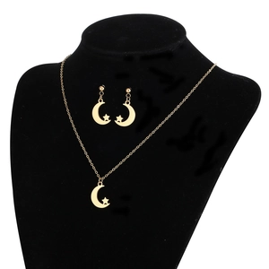 Minimalist gold stainless steel jewelry set with moon and star pendants on black model neck