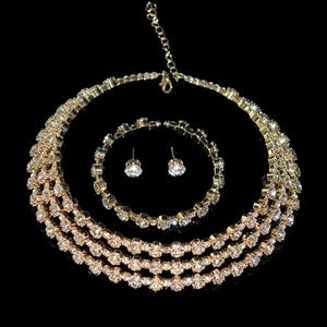 Detailed view of luxury gold-plated crystal necklace, bracelet and earrings jewelry set