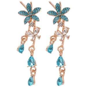 Elegant gold flower and butterfly drop earrings with blue rhinestones on white background