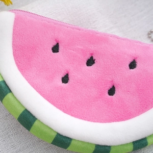 Cute pink plush watermelon coin purse with soft texture and vibrant slice design