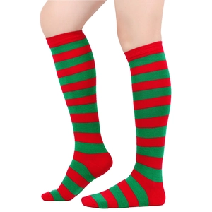 Close-up detail of festive red and green horizontal striped knee-high socks on a model