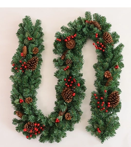 Detailed view of 2.7m Christmas garland with pine cones and vibrant red berries