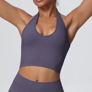 Detail view of purple ribbed knit sports bra featuring high-stretch fabric and halter neck