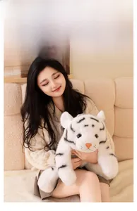 Close-up of soft white tiger plush toy featuring premium skin-friendly faux fur texture