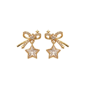 Elegant gold bow earrings with zircon star pendants on a clean white background