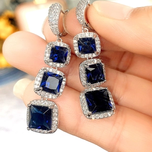 Elegant long drop earrings with blue square zircons and silver micro-pave setting