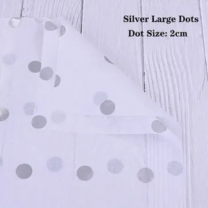 Close-up of 2cm silver polka dots on translucent white florist tissue wrapping paper