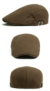 Detail view of brown herringbone ivy cap showing metal buckle and retro fabric texture