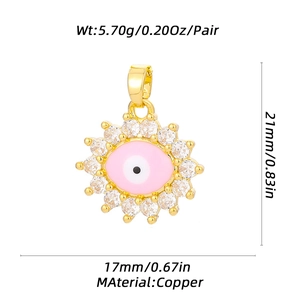 Detail of sunflower evil eye pendant with pink enamel and dimensions on white background