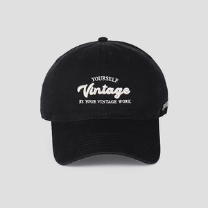 Close-up of premium letter embroidery on black vintage cotton baseball cap with ventilation