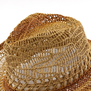 Detailed macro view of ombre straw cowboy hat with breathable hollow-out weave pattern