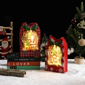 Lighted musical Christmas gift bag lantern with Santa and snowman scene and glitter